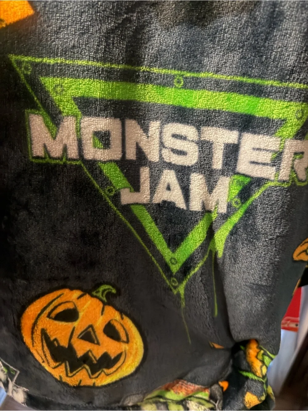 Monster Jam Plush Throw Blanket - Black with Orange & Green